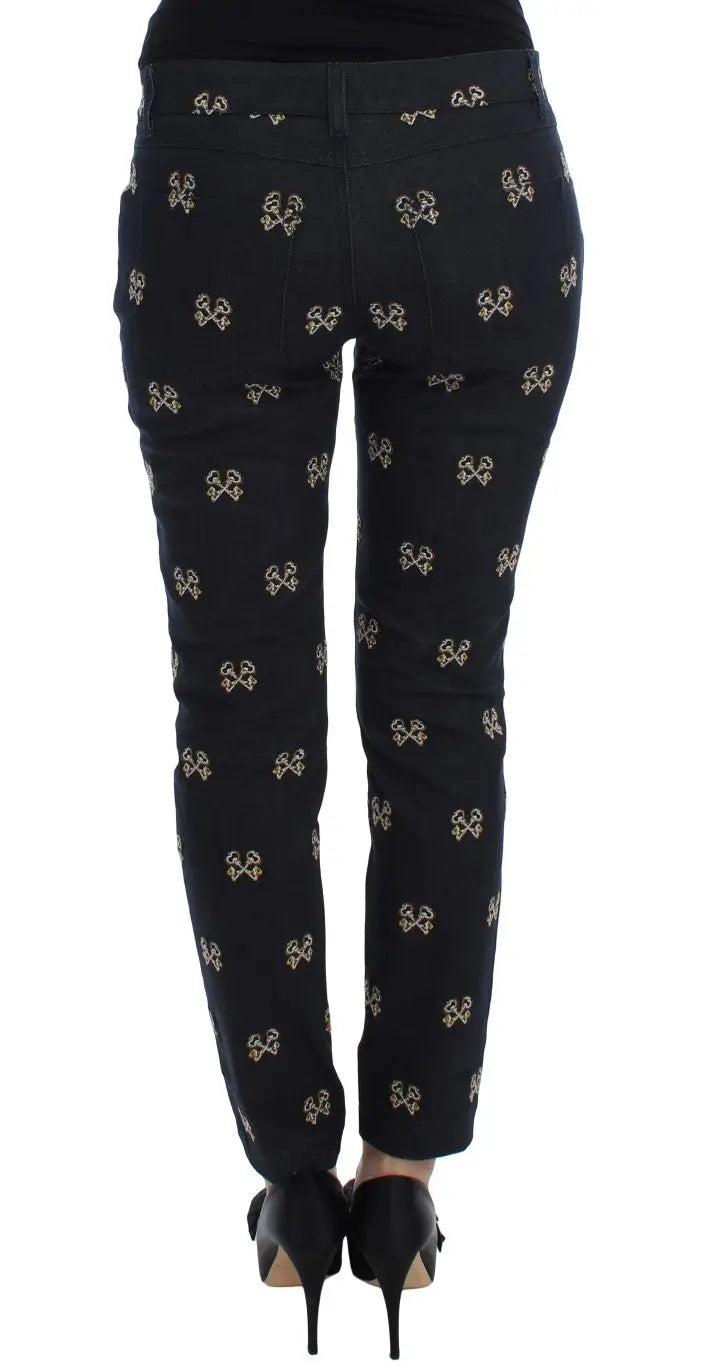 Pantalon slim en denim noir dolce & gabbana avec motif répétitif de petits nœuds dorés brodés