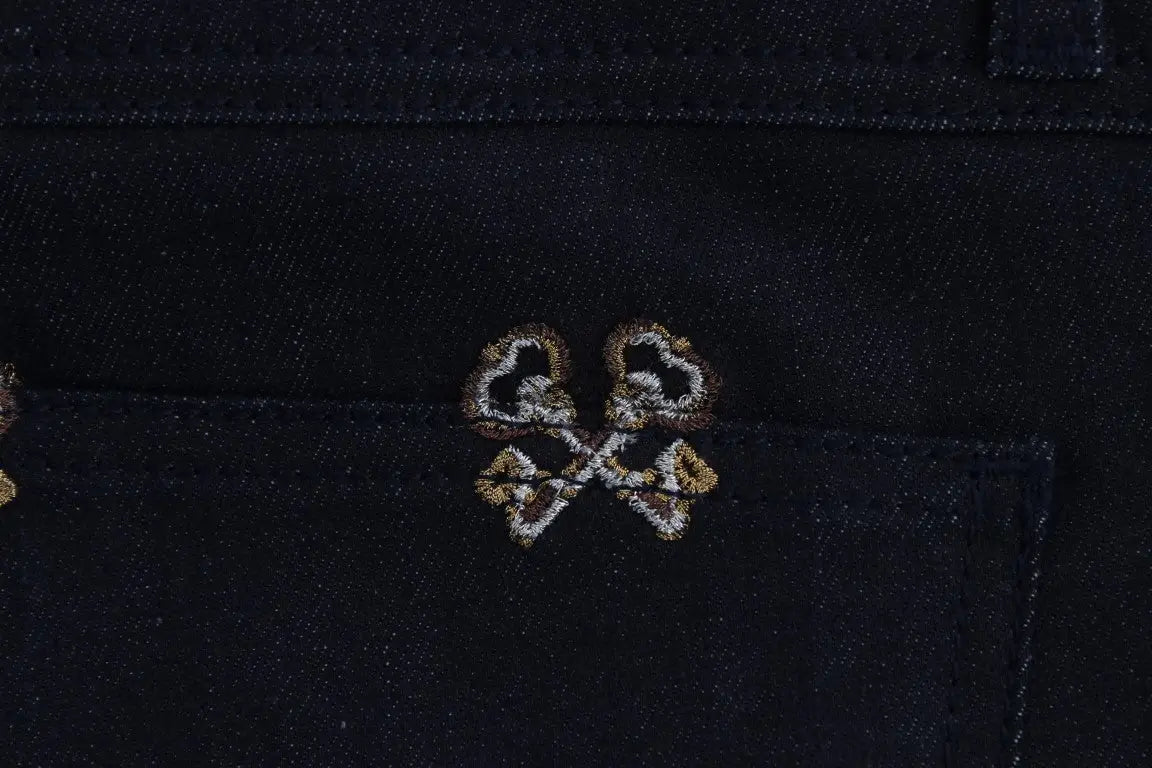 Jean slim fit kate dolce & gabbana en denim bleu avec logo finement brodé en fils or et blanc
