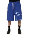 Shorts bermuda en coton bleu royal dolce & gabbana avec cordons blancs et logo rectangulaire sur la jambe gauche