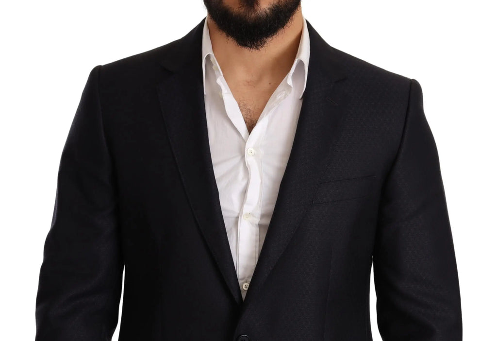 Blazer noir tailored dolce & gabbana avec revers crantés et design croisé porté sur chemise blanche dans costume slim fit martini bleu à motifs