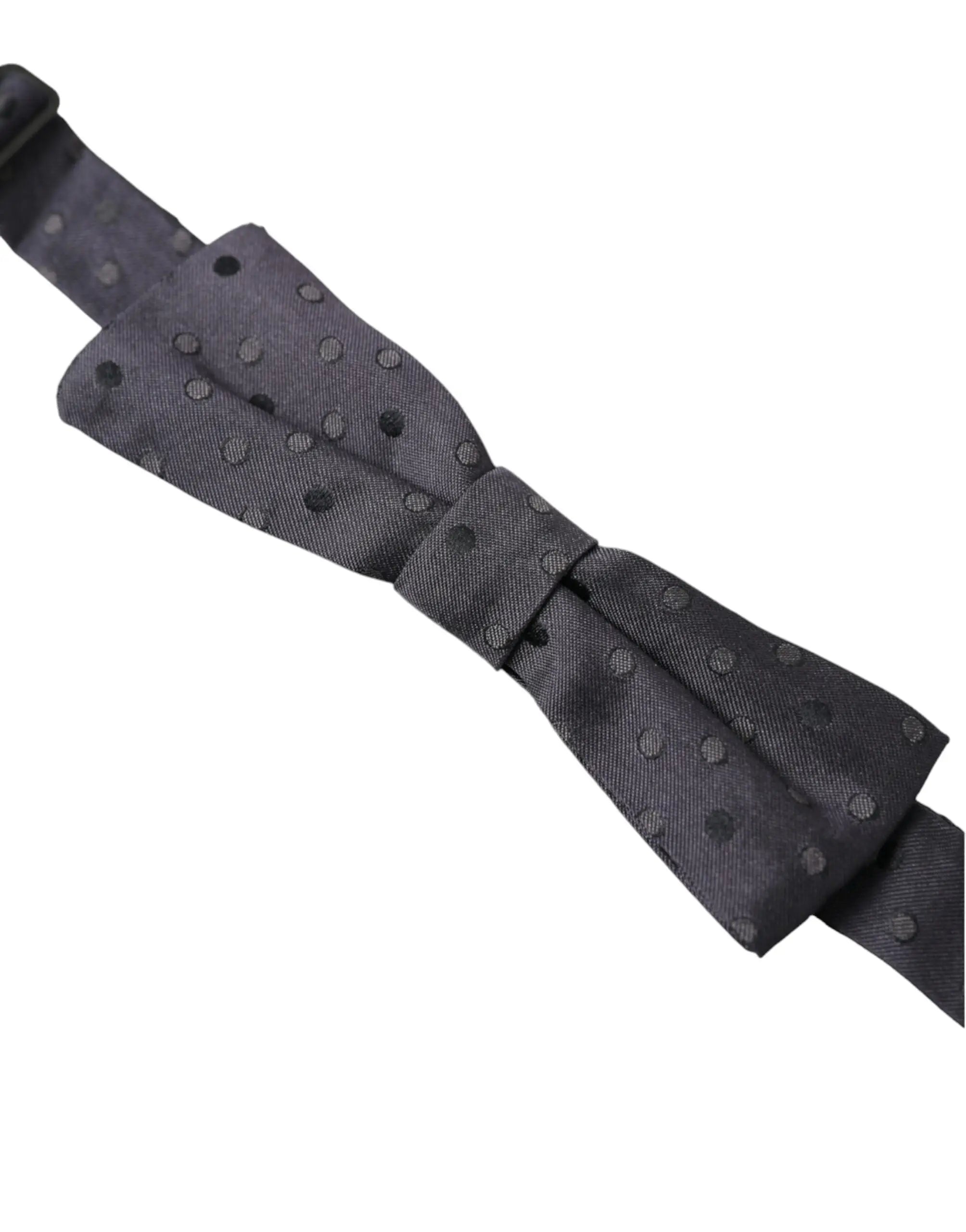 Un nœud papillon dolce & gabbana bleu à pois en soie ajustable pour homme avec tissu lisse et subtil motif polka dot