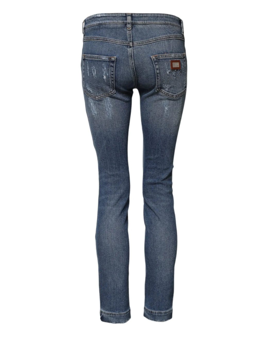 Jeans skinny denim bleu Dolce & Gabbana avec effet délavé, détails usés et patch cuir marron au dos