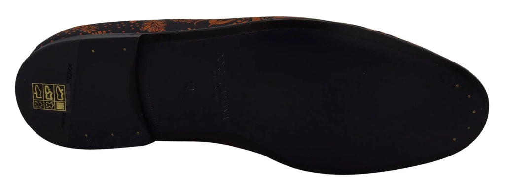 Semelle noire de chaussure dolce & gabbana avec motif floral décoratif orange et marron sur le bord extérieur