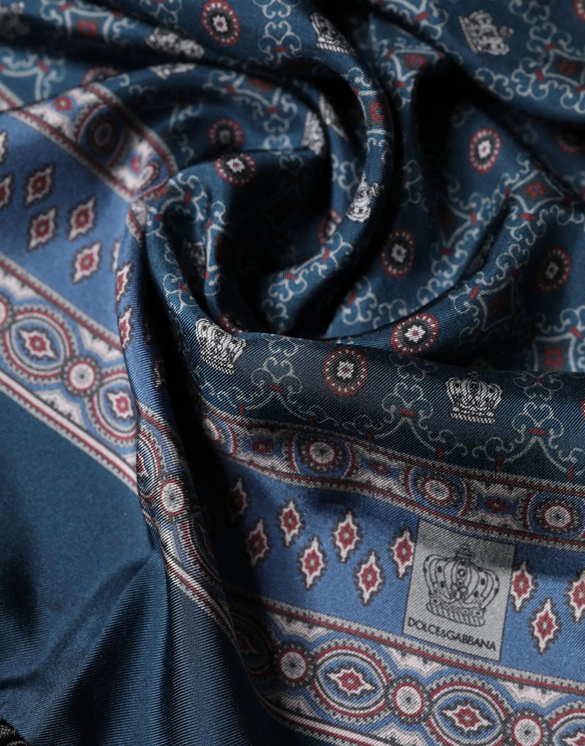 Navy blue dolce gabbana silk scarf with intricate red white and gold crowns and geometric motifs 184cm x 33cm