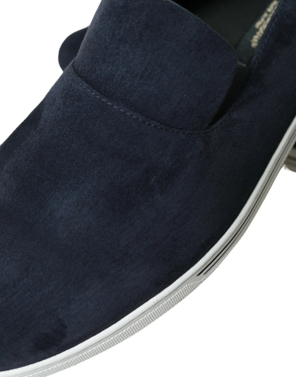 Navy blue suede slip-on loafer with white rubber sole from Dolce & Gabbana Blue Suede Caiman Loafers Saint Tropez