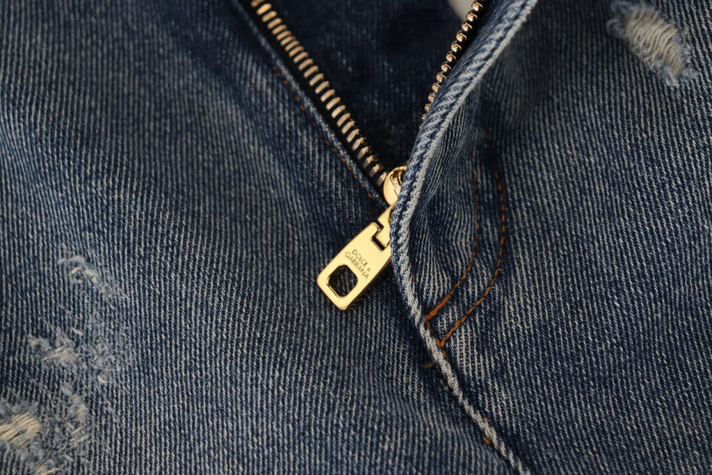 Fermeture éclair dorée gravée dolce & gabbana sur jean skinny en coton bleu foncé délavé tâché