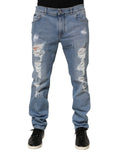 Jean denim bleu clair dolce gabbana slim en coton avec déchirures effilochées aux cuisses et genoux