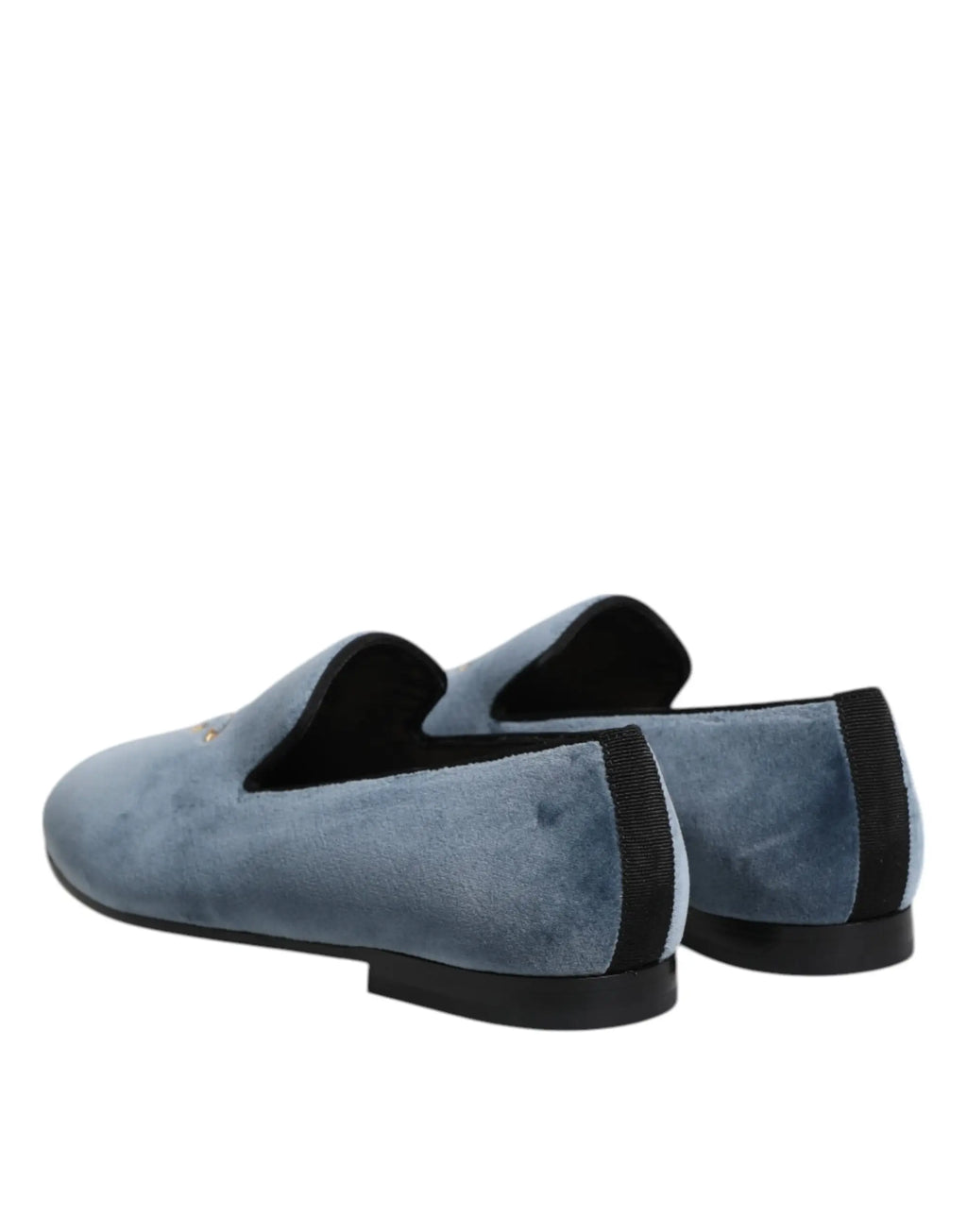 Vue arrière des mocassins formels dolce & gabbana en velours bleu avec semelles en caoutchouc noir et logo doré subtil