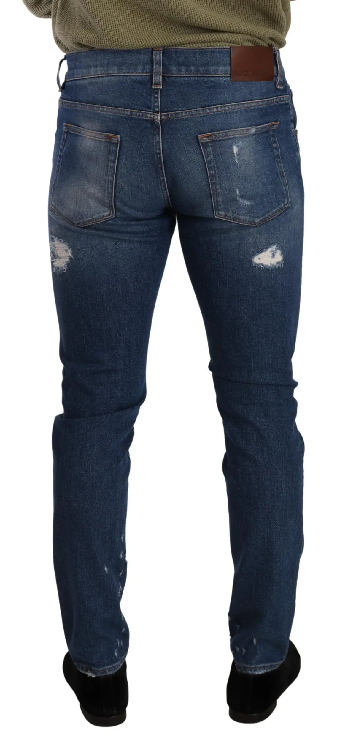 Jean slim fit en denim bleu délavé avec patchs usés et patch en cuir marron dolce gabbana au niveau de la ceinture