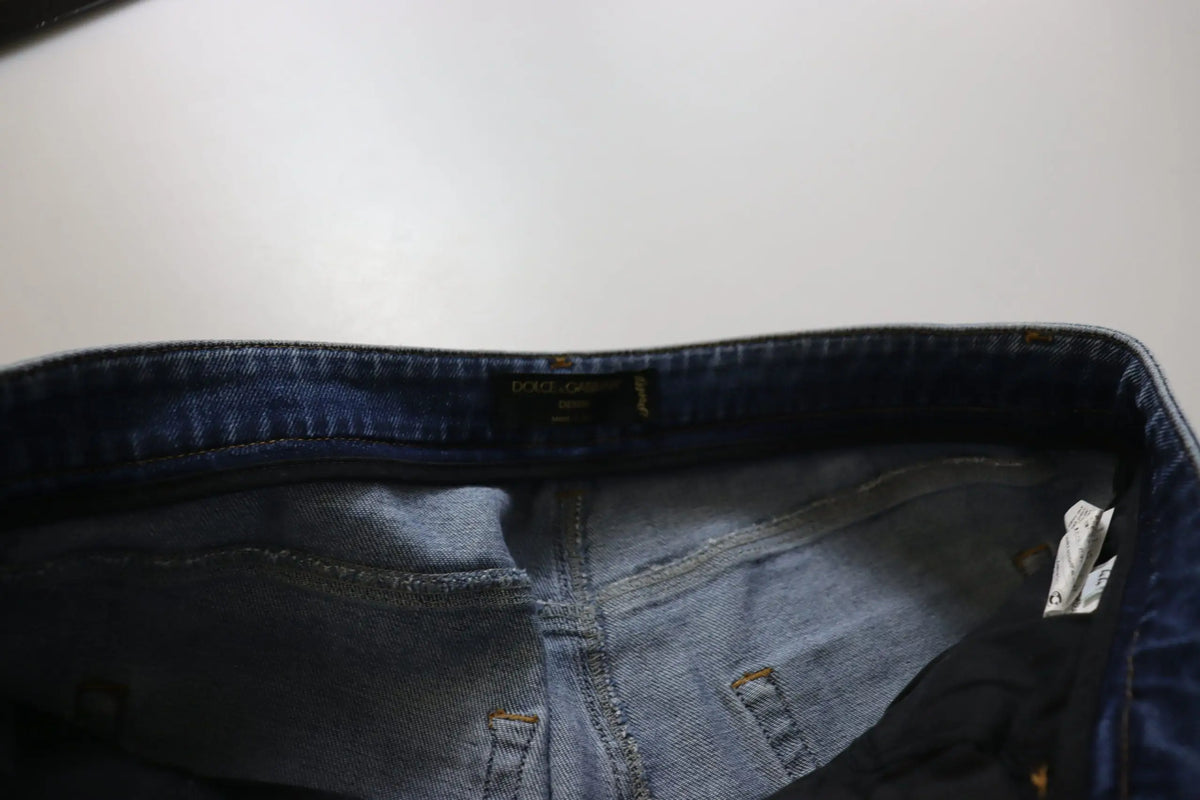 Jean skinny bleu lavé en coton de dolce et gabbana avec taille basse et étiquette de marque visible à la taille