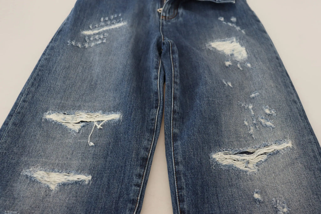Jean denim délavé bleu dolce gabbana en coton avec déchirures et zones usées visibles sur le devant