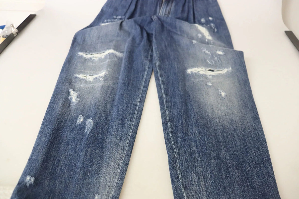Pantalon bleu dolce & gabbana en jean délavé avec taille haute, coupe ample et déchirures tendance