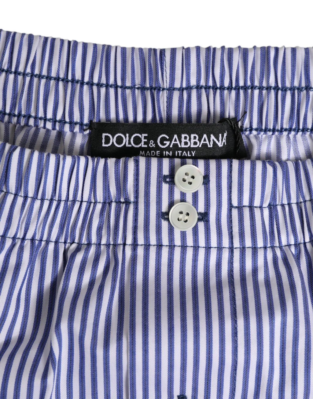 Short en coton rayé bleu et blanc dolce gabbana avec fermeture à boutons et étiquette noire élégant pour la plage
