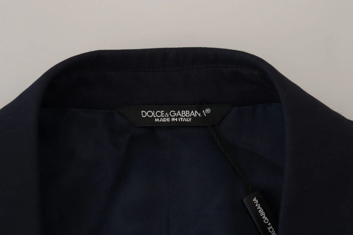 Étiquette noire dolce & gabbana en tissu avec lettrage blanc indiquant made in italy sur manteau bleu en laine slim fit formal