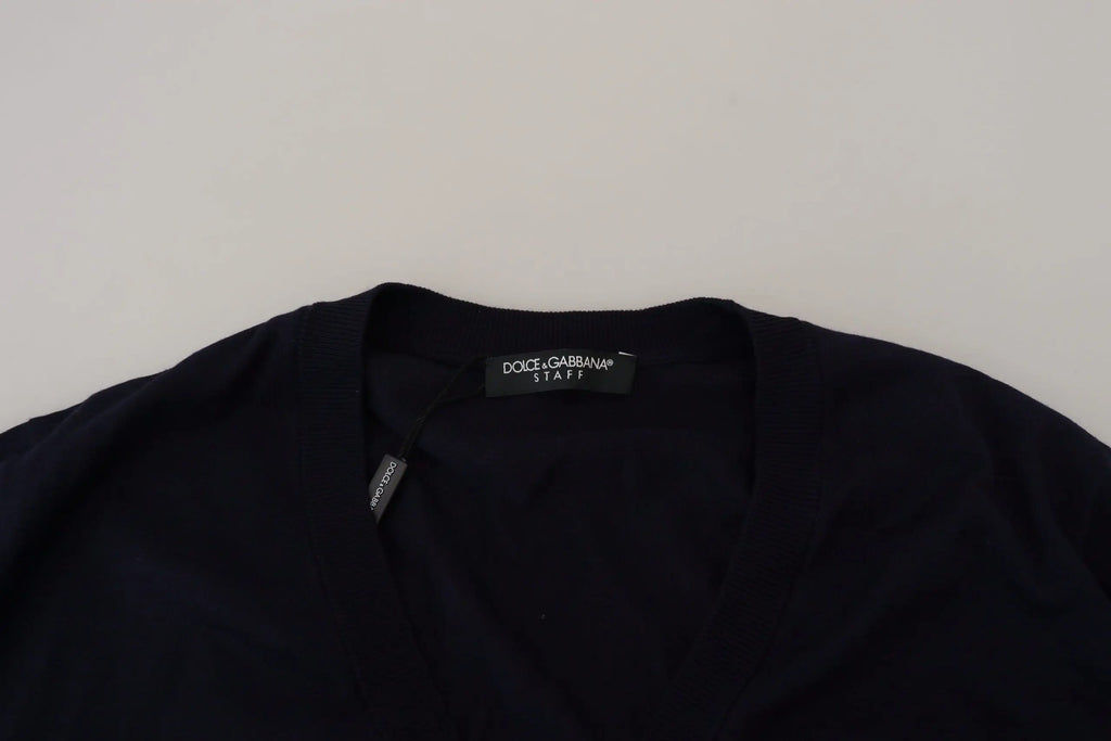 Dolce & gabbana blue wool staff down cardigan with a black cotton top featuring a crew neckline and subtle stitching