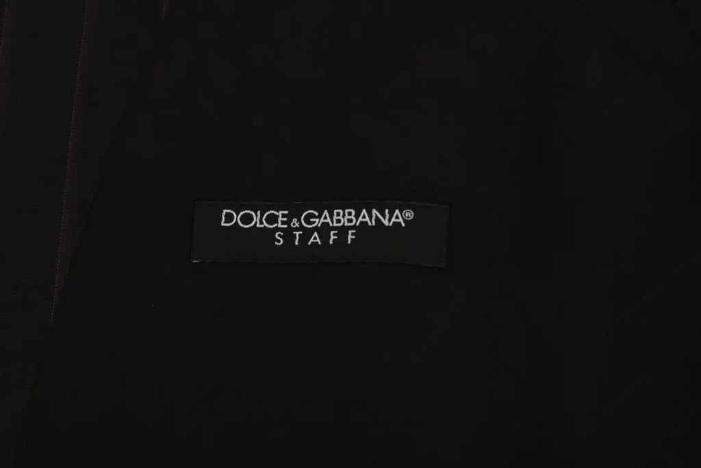 Étiquette noire dolce & gabbana sur un gilet bleu en laine stretch pour homme