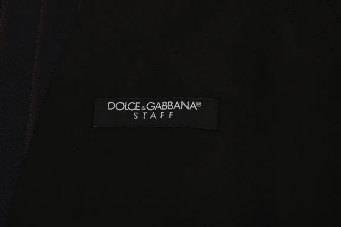 Étiquette noire dolce & gabbana sur un gilet bleu en laine stretch pour homme