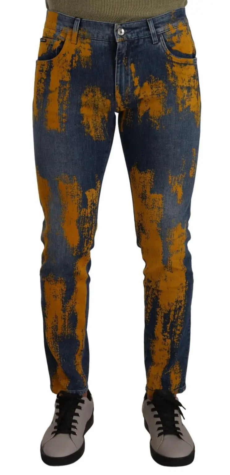 Jean slim homme en coton bleu et jaune avec design moderne délavé et effet peinture signé dolce & gabbana
