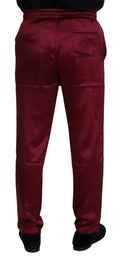 Pantalon de détente bordeaux en soie dolce & gabbana vu de dos avec taille à cordon et poches arrière en satin