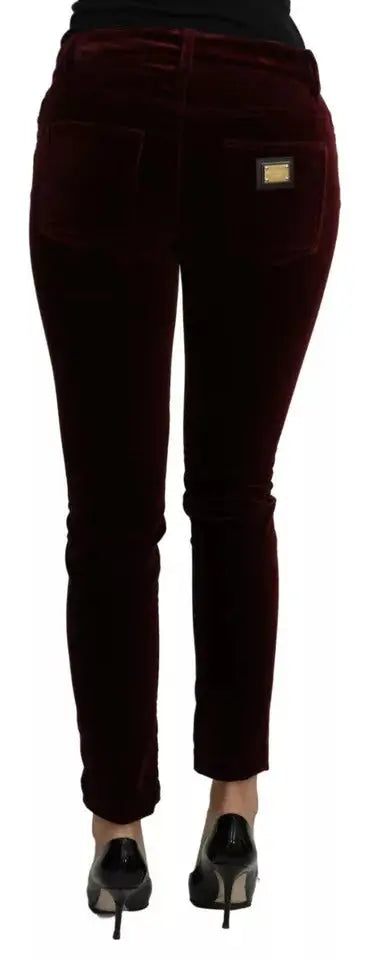 Jeans skinny en velours bordeaux avec plaque marque dorée sur la poche arrière dolce gabbana