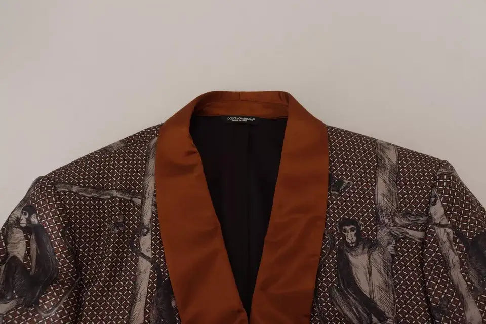 Robe dolce & gabbana en satin bronze avec imprimé singe noir et blanc sur tissu foncé à motifs