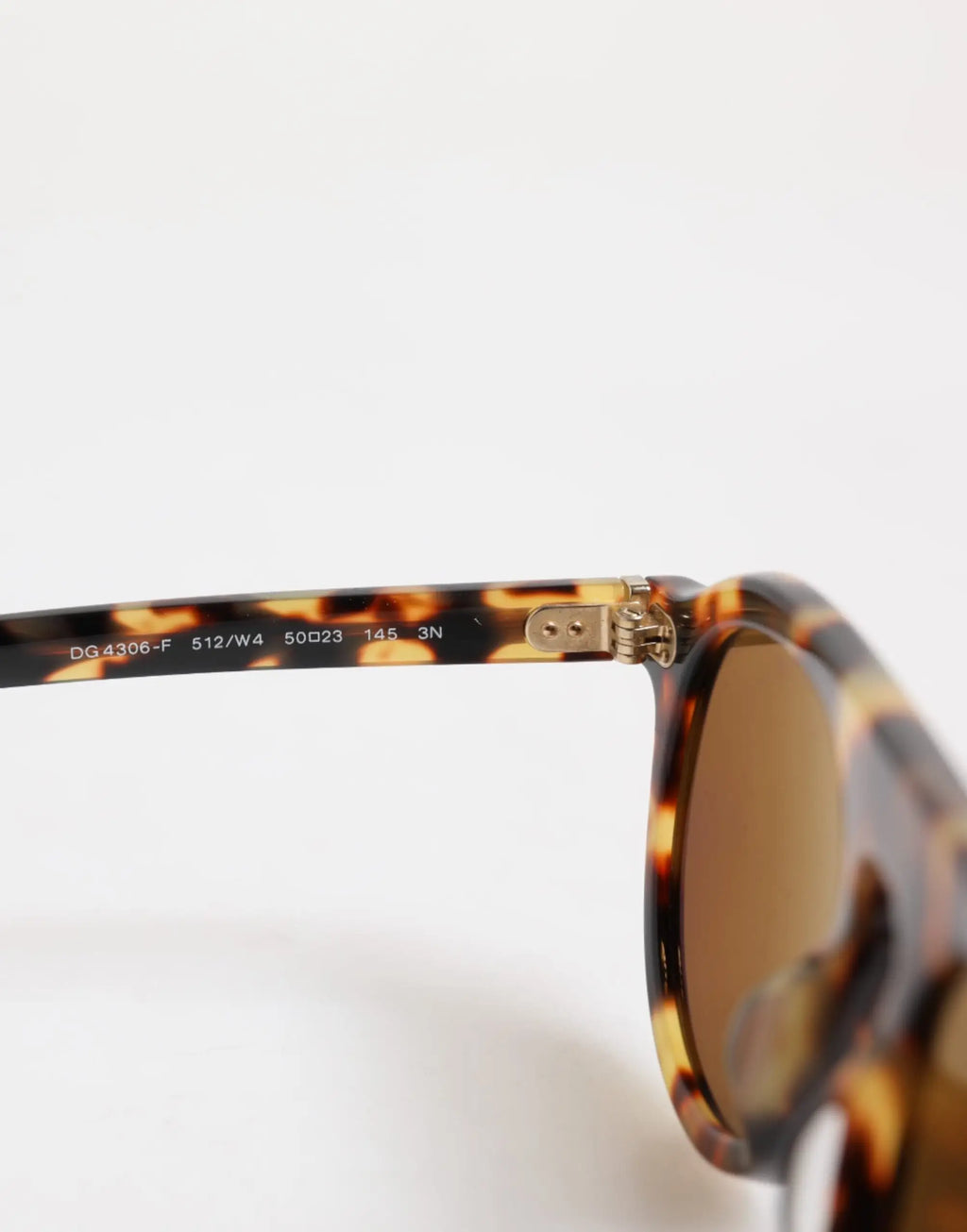 Lunettes de soleil rondes dolce & gabbana en acétate léopard marron avec charnières métal doré et verre miroir brun