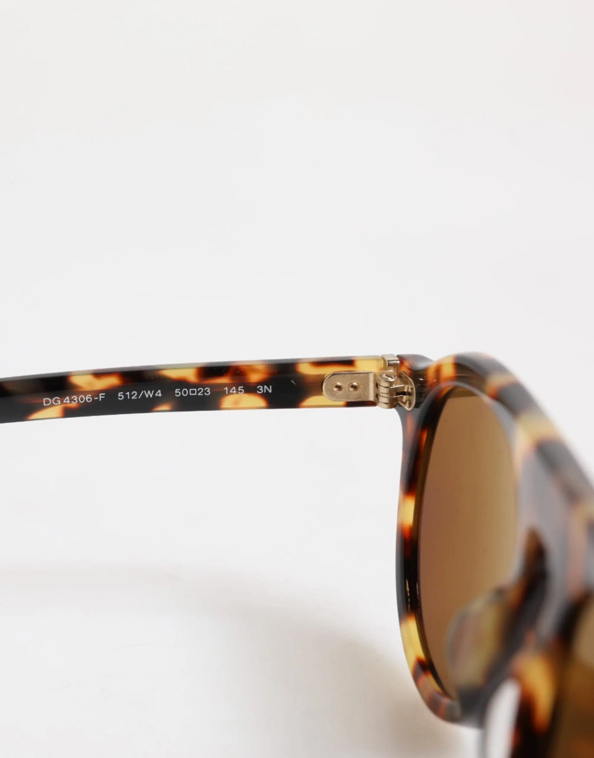 Lunettes de soleil rondes dolce & gabbana en acétate léopard marron avec charnières métal doré et verre miroir brun