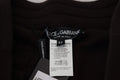 Étiquette noire dolce & gabbana avec texte blanc sur pantalon marron en cachemire à taille à cordon