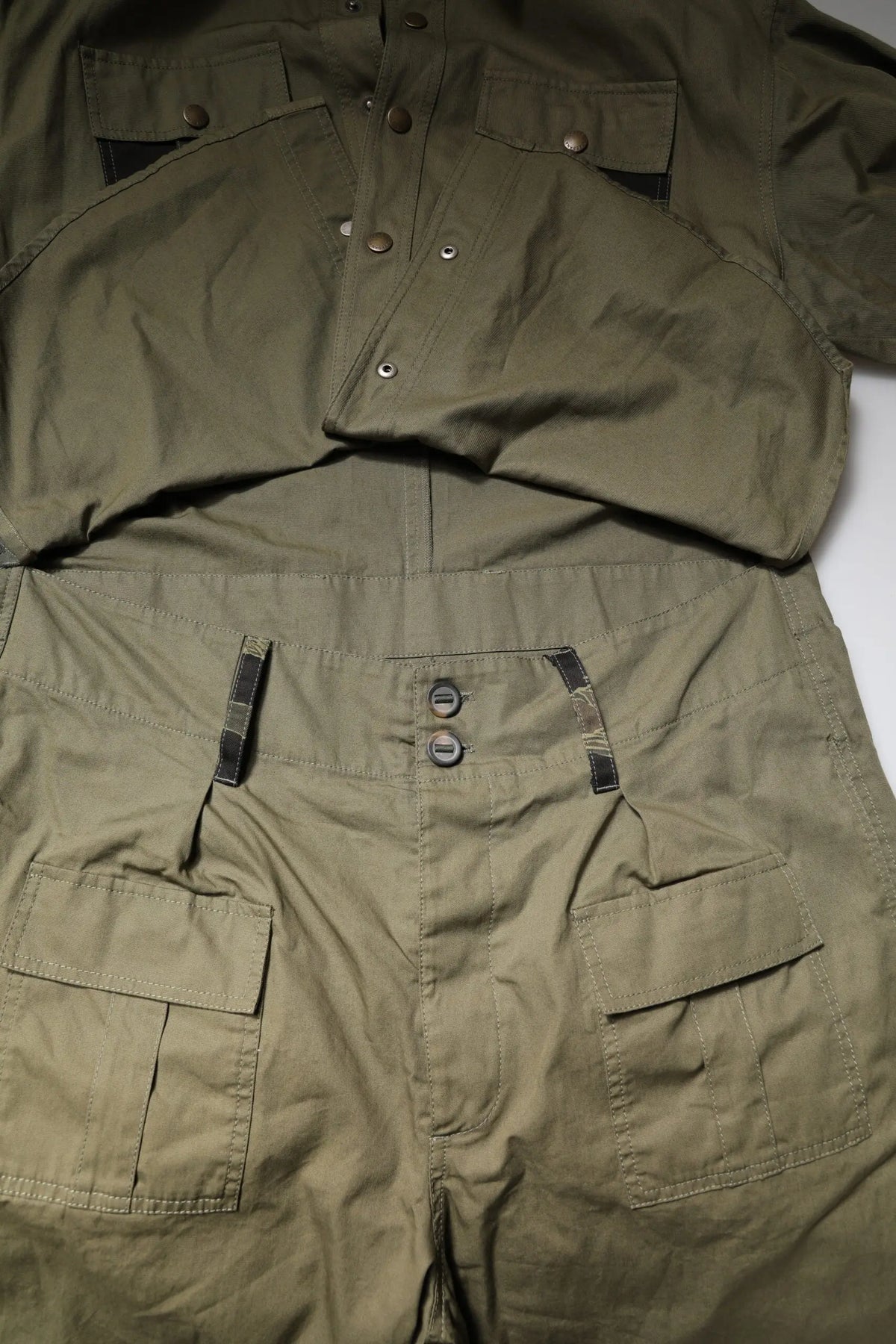 Olive green utility jumpsuit with multiple pockets and button closures in dolce & gabbana brown cotton stretch shirt pants casual set