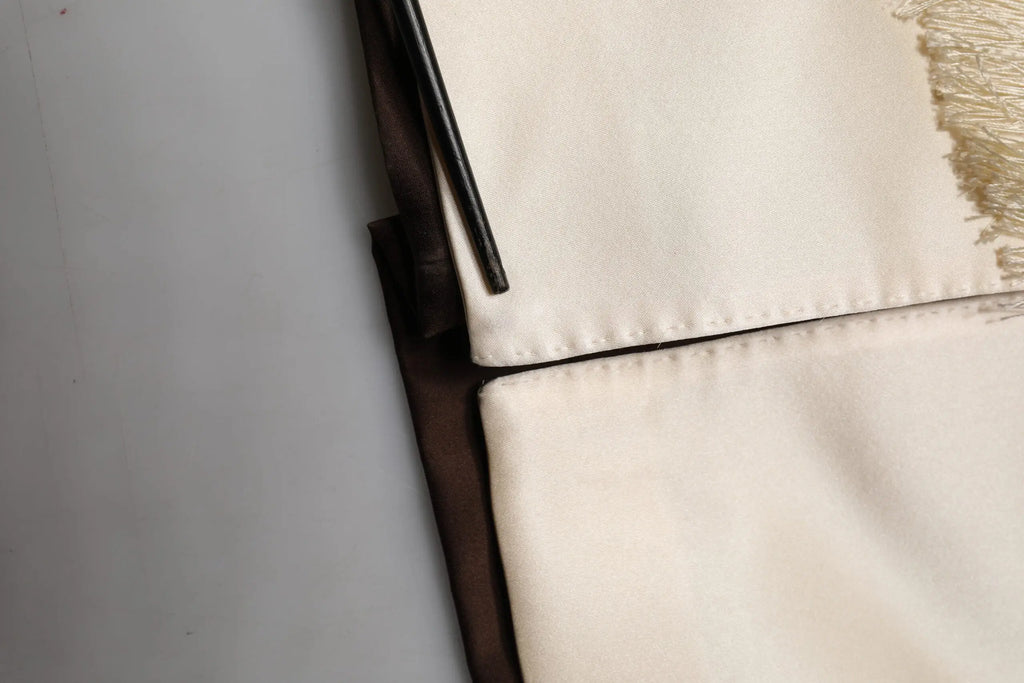 Off-white canvas cushion with dark brown piping and textured fringe detail for dolce & gabbana brown cream lounge belted bathrobe jacket