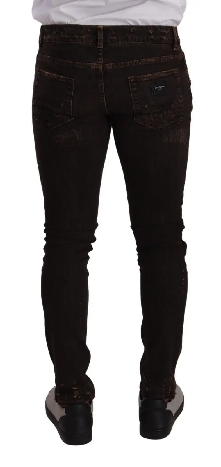 Jean slim fit skinny en denim noir distressed avec légère décoloration aux cuisses dolce & gabbana