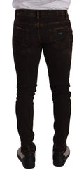 Jean slim fit skinny en denim noir distressed avec légère décoloration aux cuisses dolce & gabbana