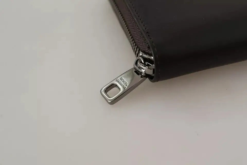 Portefeuille continental à fermeture éclair en cuir noir avec tirette en métal argenté gravée dolce & gabbana