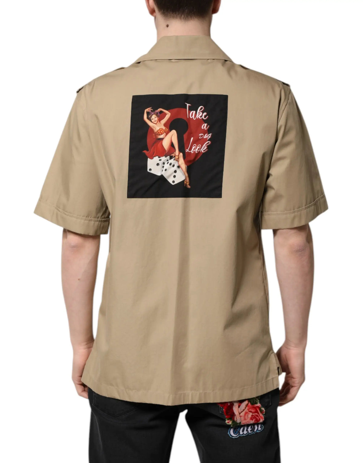 Beige Dolce & Gabbana short-sleeved shirt with black back patch featuring red pin-up illustration and white text
