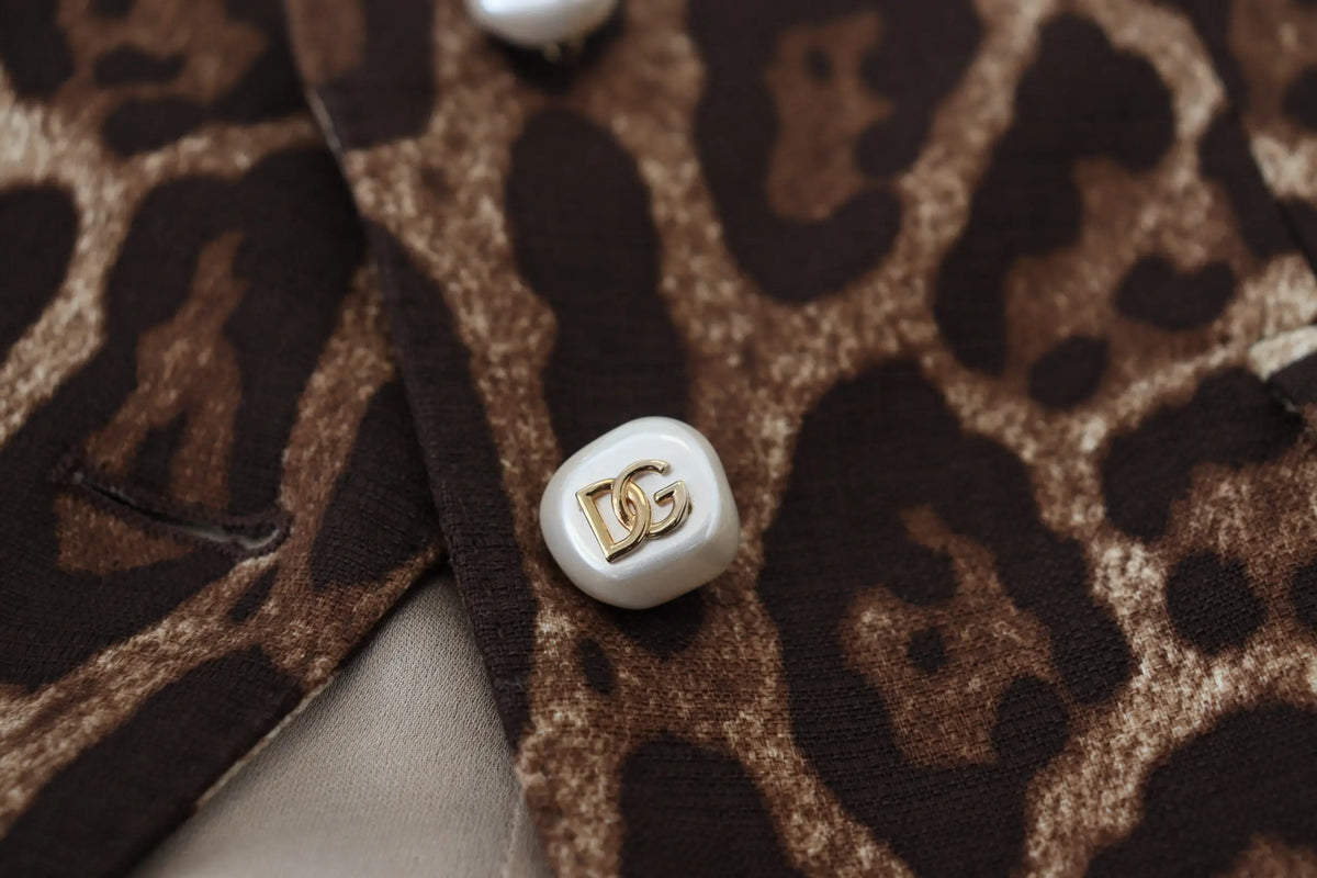 Bouton blanc nacré orné du logo dg sur jupe mini trapèze en laine imprimé léopard marron dolce gabbana