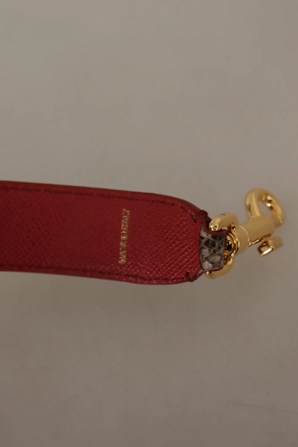Brown python leather studded shoulder strap by dolce & gabbana with red leather strap and gold-tone clasp embossed made in italy