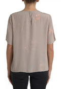 Blouse dolce & gabbana beige doux avec détail noué au col et motifs roses abstraits sur tissu léger
