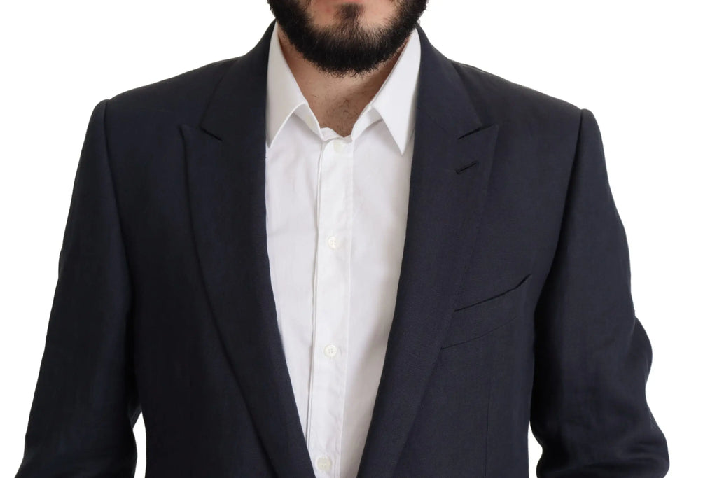 Veste noire ajustée dolce & gabbana avec revers crantés portée sur chemise blanche élégante