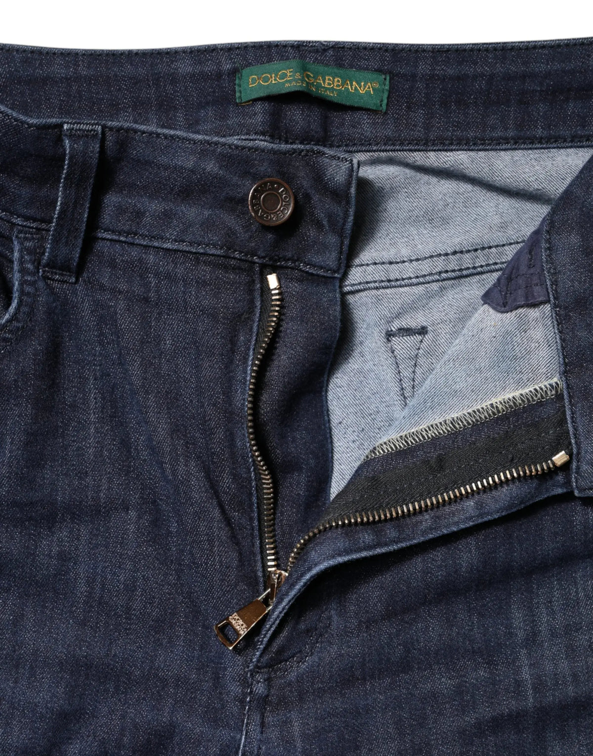 Jeans en denim skinny cropped bleu foncé dolce & gabbana en coton avec étiquette verte et accessoires en laiton