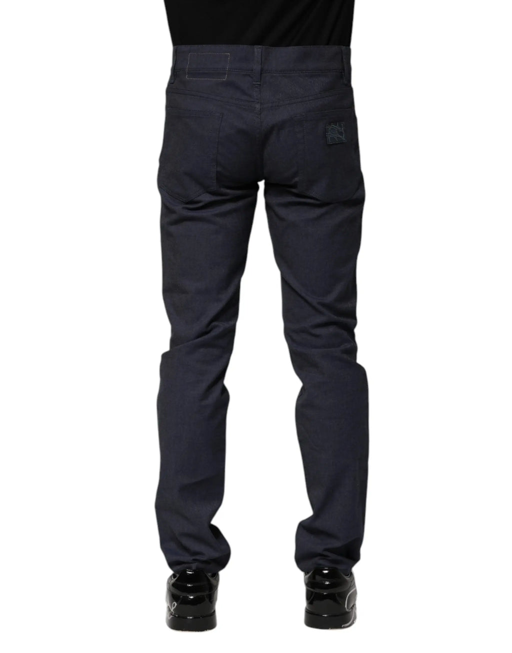 Vue arrière de jean slim en coton bleu marine dolce gabbana avec tissu texturé et logo brodé sur la poche arrière droite
