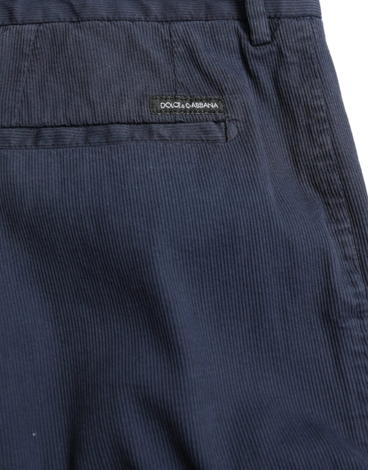 Pantalon slim bleu foncé dolce gabbana en coton stretch avec texture côtelée subtile et logo sur la ceinture