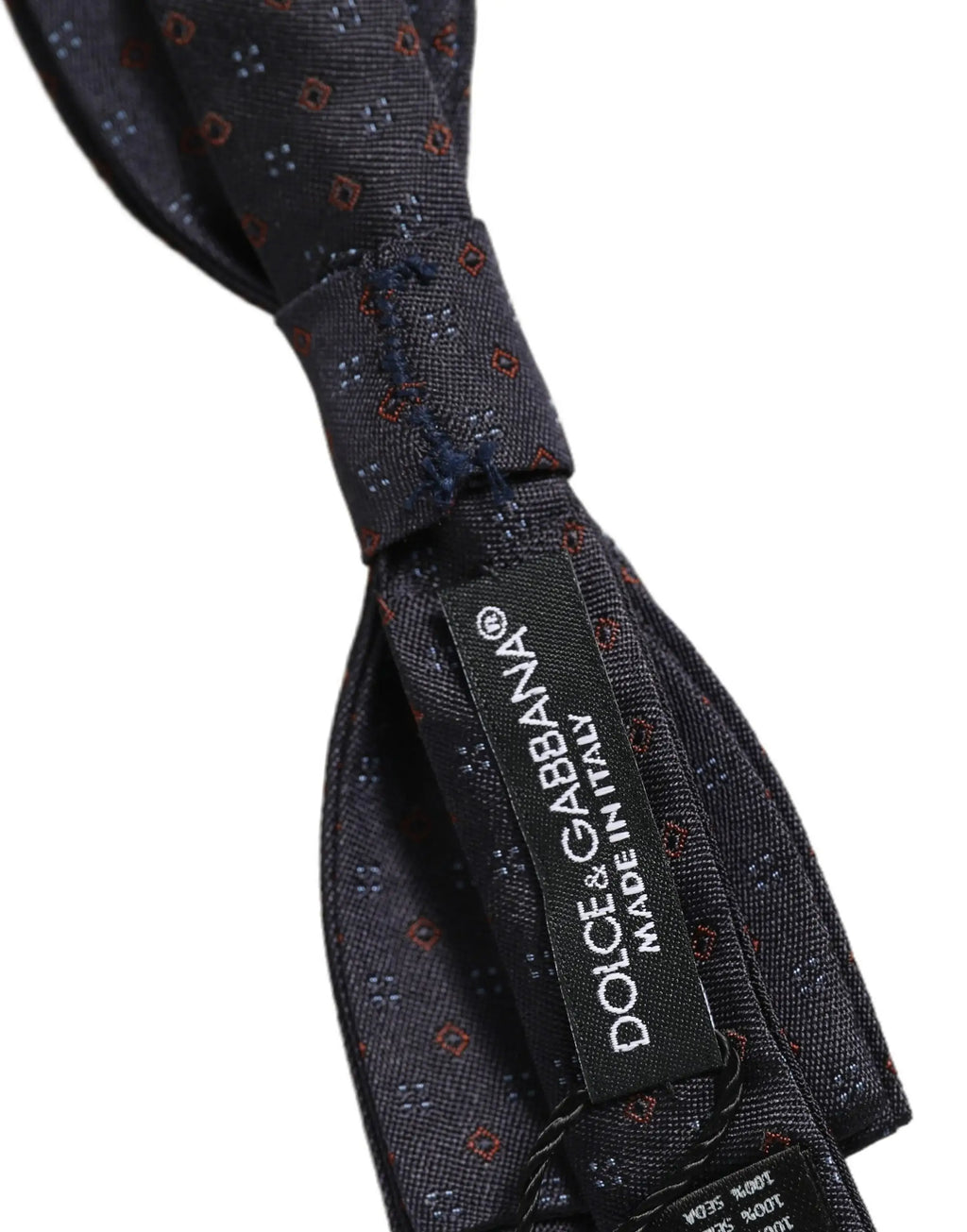 Dolce & gabbana dark blue silk bow tie with red and gray geometric pattern and made in italy label