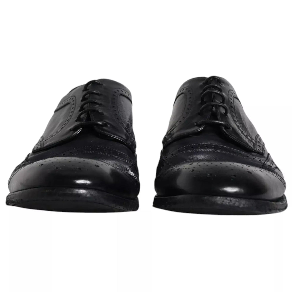 Dolce & gabbana chaussures derby wingtip en cuir bleu foncé avec détails perforés et finition polie pour usage formel
