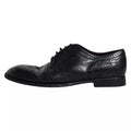 Chaussure derby wingtip formelle dolce & gabbana en cuir bleu foncé avec perforations détaillées et finition polie