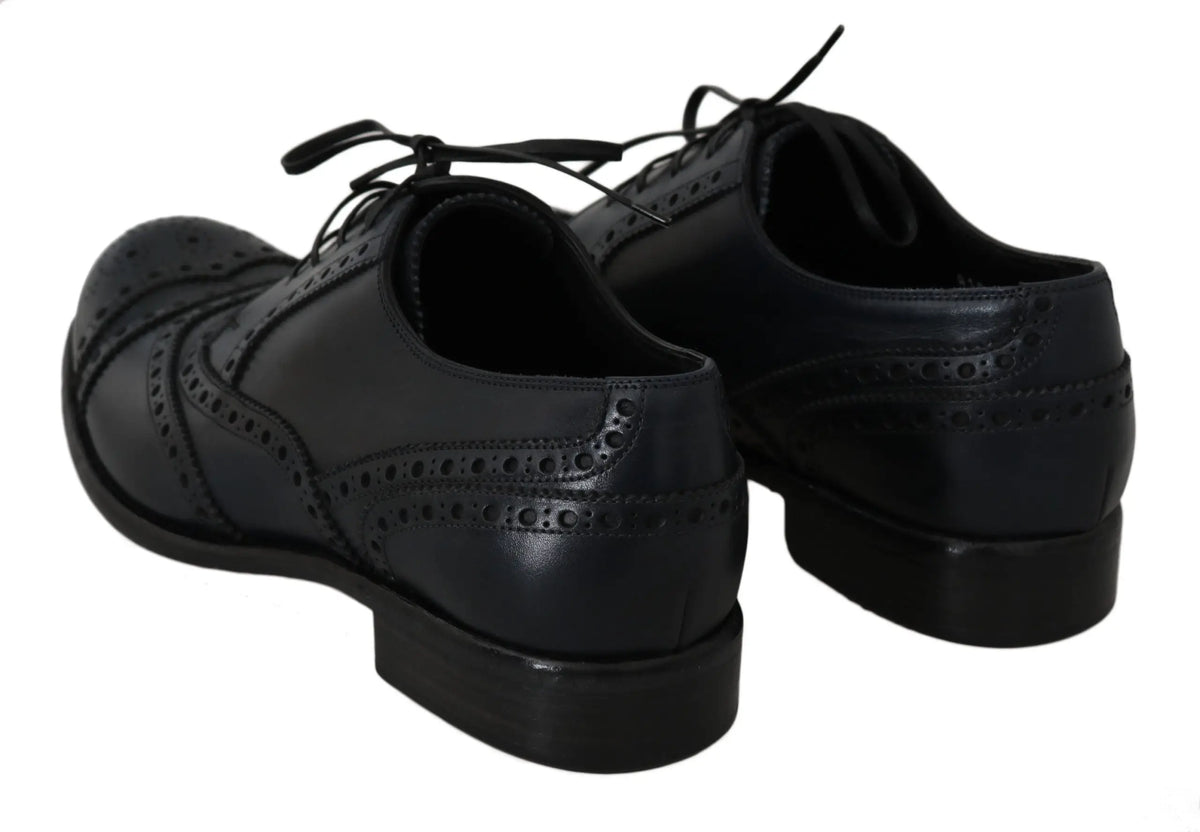 Dolce & gabbana chaussures derby en cuir bleu foncé avec motifs perforés et lacets pour homme élégant