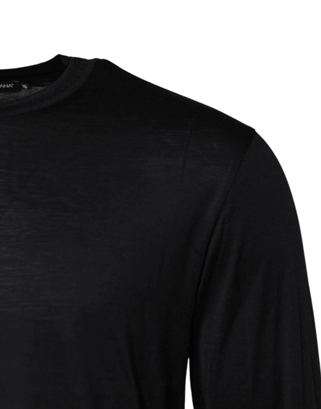 T-shirt noir à manches longues en tissu léger et doux présenté avec un pull en soie bleu foncé dolce & gabbana