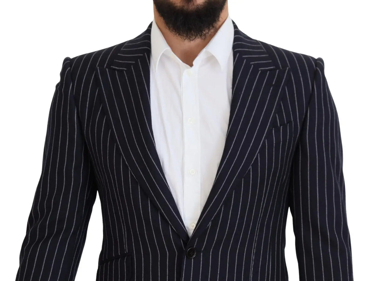 Dolce & gabbana blazer en laine bleu marine à rayures fines blanches porté avec une chemise blanche élégante