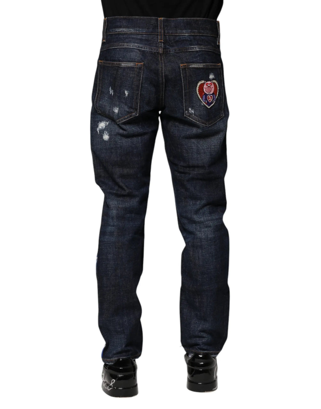 Jeans skinny en denim bleu foncé dolce gabbana avec patch cœur brodé rouge blanc bleu au dos