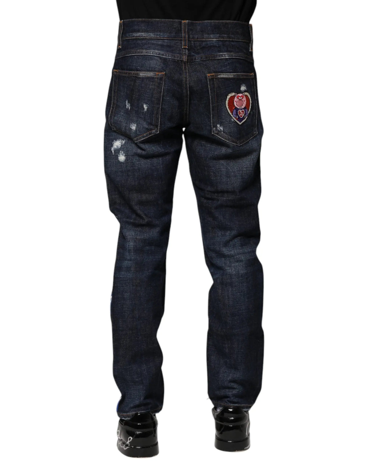 Jeans skinny en denim bleu foncé dolce gabbana avec patch cœur brodé rouge blanc bleu au dos
