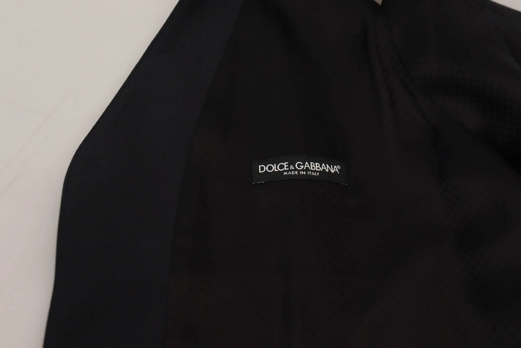 Étiquette noire dolce & gabbana avec lettrage blanc made in italy sur gilet formel bleu foncé en laine stretch